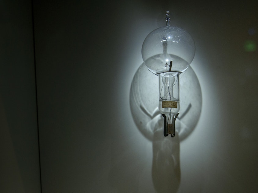 caption: General Electric has been making lightbulbs for more than a century but is now selling its lighting business. Above, a lightbulb is displayed at the Smithsonian's National Museum of American History in Washington, D.C., in 2015.