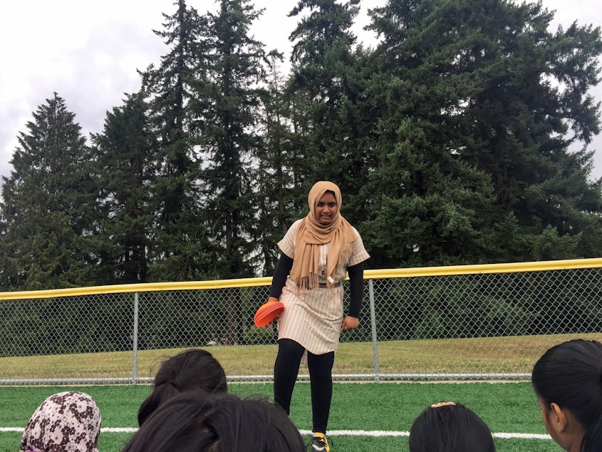 caption: Noor Aamir coaching at the soccer camp.