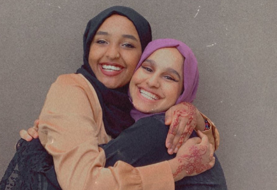 caption: Najuma Abadir (left) and Sadeen Al Ziyad outside a Starbucks in Lake City on Eid Al-Adha July 20, 2021.