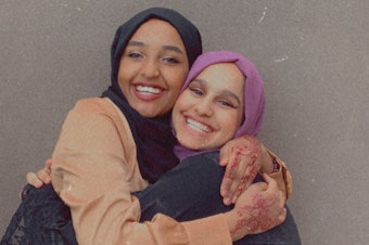 caption: Najuma Abadir (left) and Sadeen Al Ziyad outside a Starbucks in Lake City on Eid Al-Adha July 20, 2021.