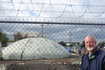 caption: Retired engineer Dan Witmer stands by a defunct Minuteman missile silo where he used to work in the 1960s.  The silo is located just off East Marginal Way, across the street from the Museum of Flight.
