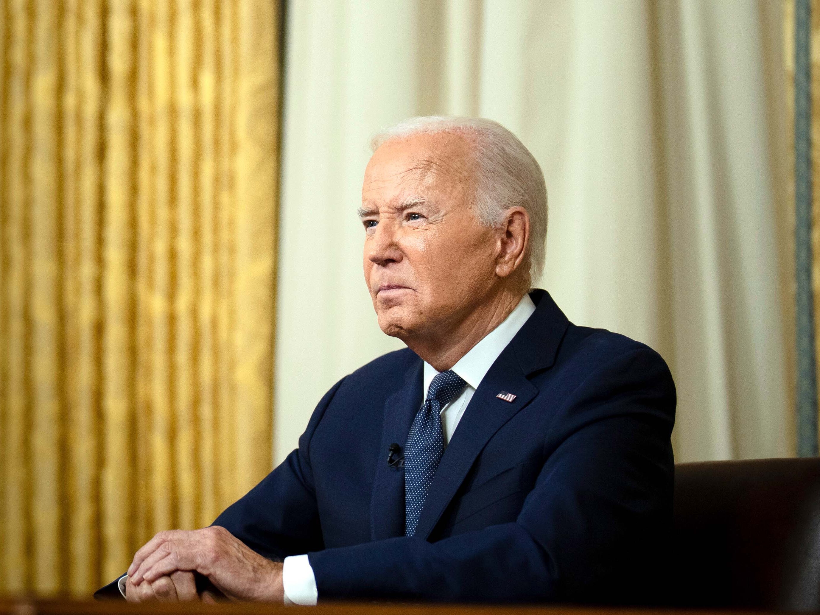 caption:  President Joe Biden addresses the nation from the Oval Office of the White House in Washington, Sunday, July 14, 2024, about the assassination attempt of Republican presidential candidate former President Donald Trump at a campaign rally in Pennsylvania. 