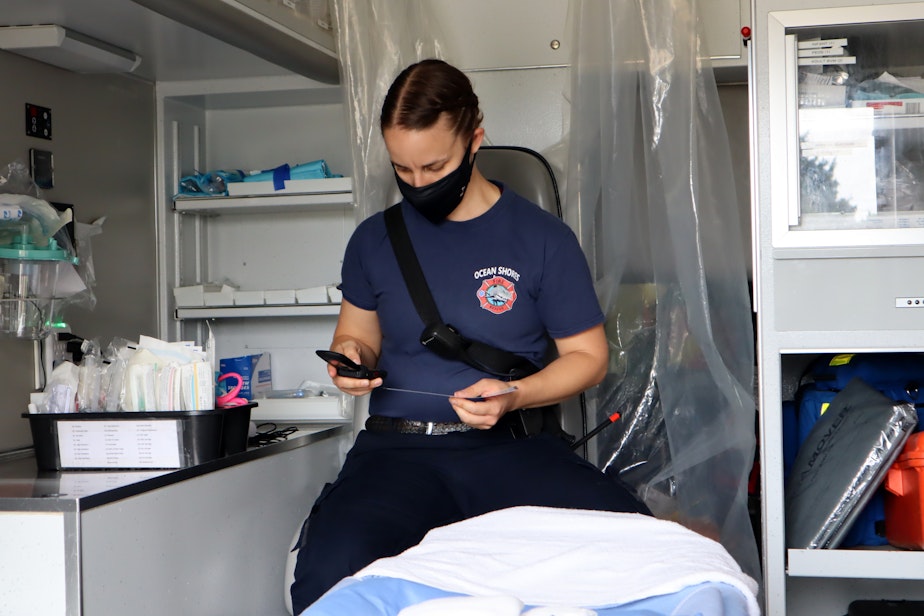 caption: A new accessory in the ambulance is a telephone tree of distant hospital emergency rooms for McDermott to dial if her rig is turned away in nearby Aberdeen, Washington.