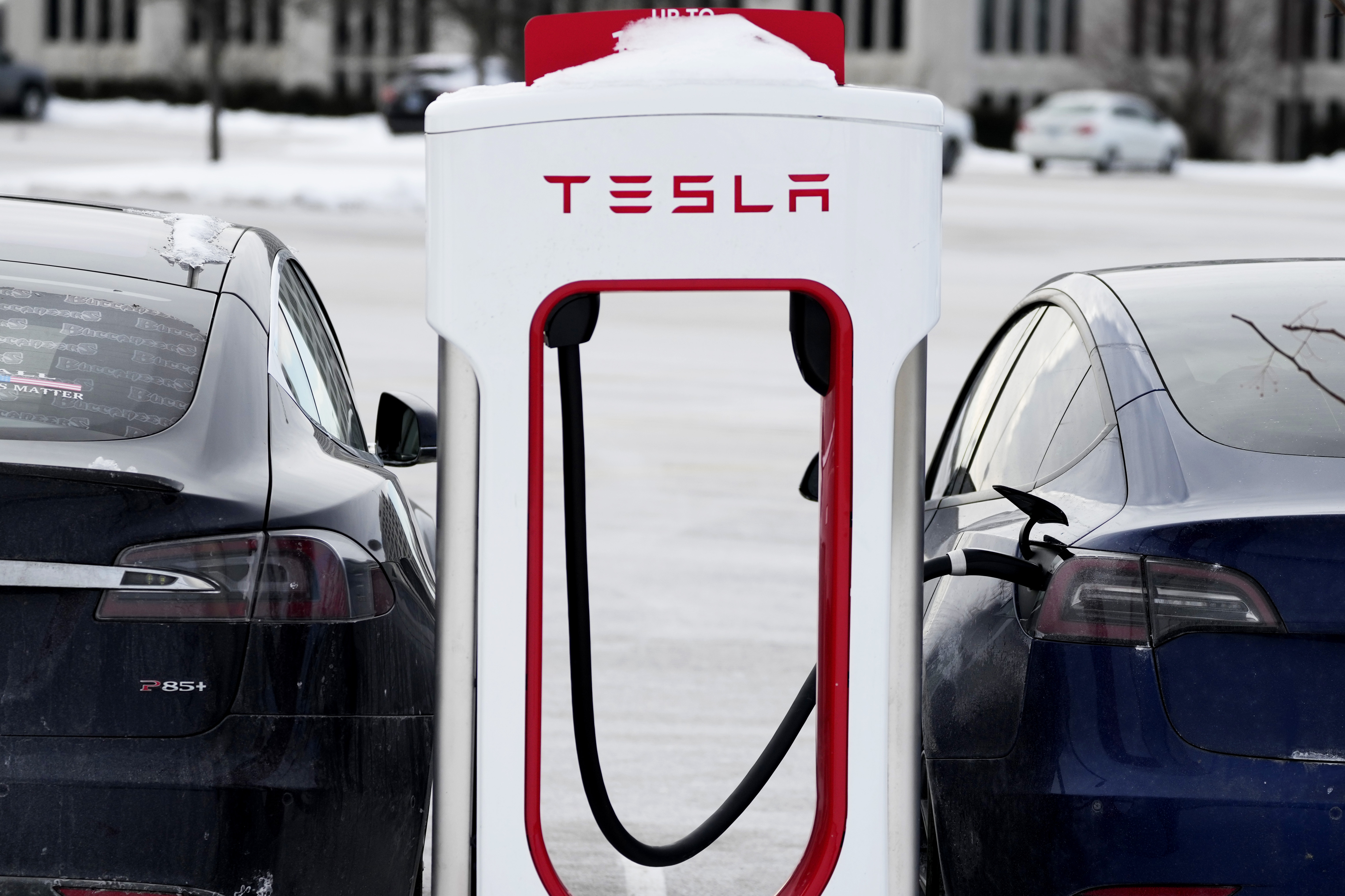 caption: Tesla Supercharger stands in Rolling Meadows, Ill., Monday, Jan. 30, 2023.