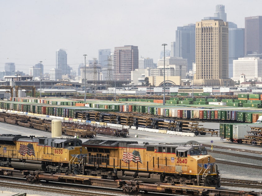 caption: The Los Angeles skyline is seen above the Union Pacific LATC Intermodal Terminal on Tuesday.