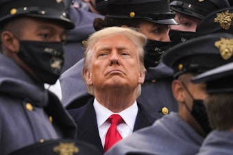 caption: Surrounded by Army cadets, President Trump watches the Army-Navy football game at the U.S. Military Academy in West Point, N.Y., on Dec. 12.