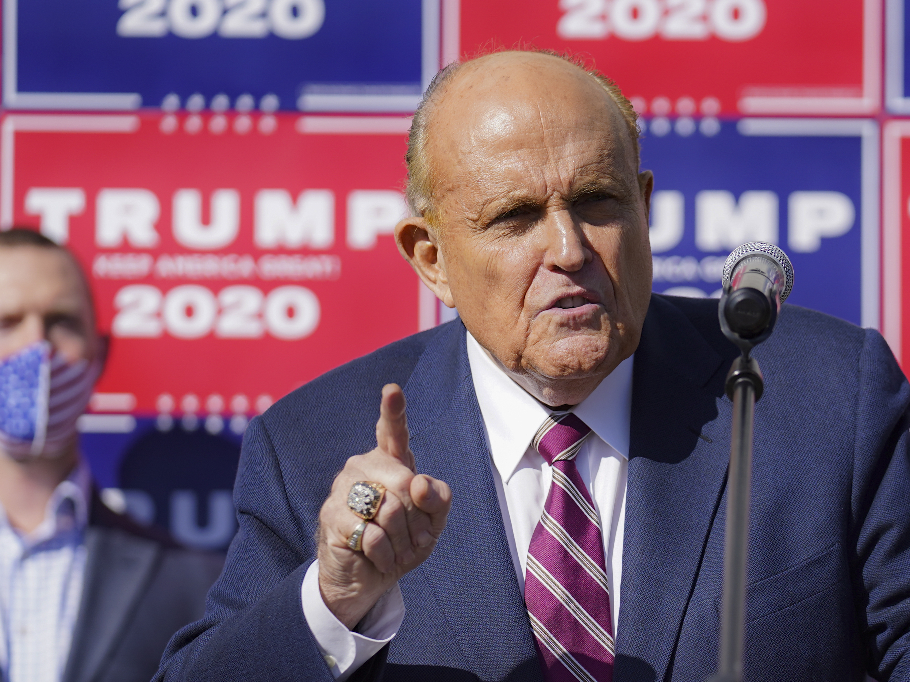 caption: Former New York mayor Rudy Giuliani, a lawyer for President Donald Trump, speaks during a news conference at Four Seasons Total Landscaping on legal challenges to vote counting in Pennsylvania, Nov. 7, 2020, in Philadelphia.