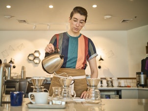 caption: Barista Steph Achter, who led the union campaign at the Milwaukee café now known as Likewise, has worked in different coffee shops for 17 years and wants others to be able to make a career of it as well.