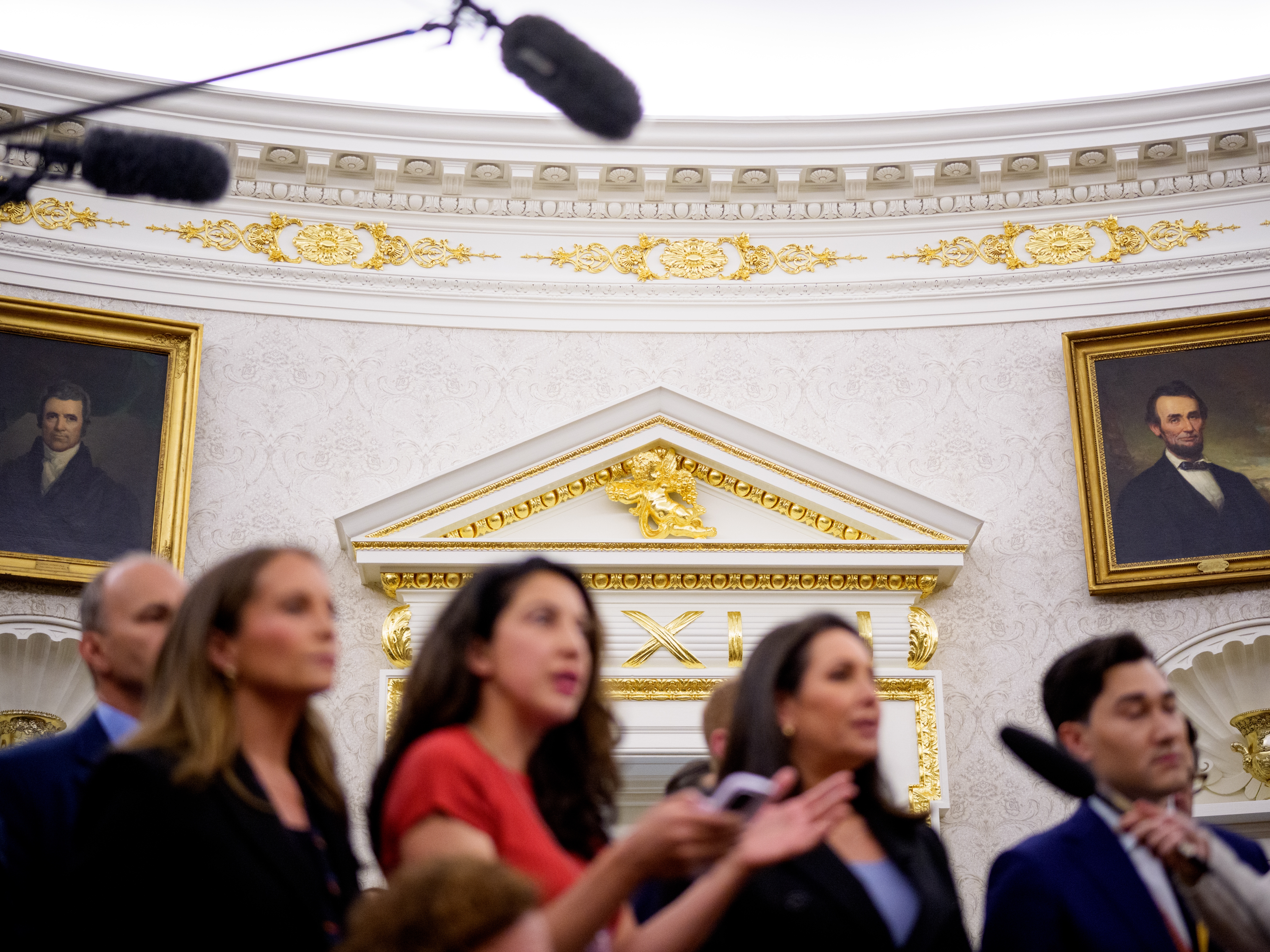 caption: Paintings and gold trim are visible behind reporters as U.S. President Donald Trump holds a swearing in ceremony.