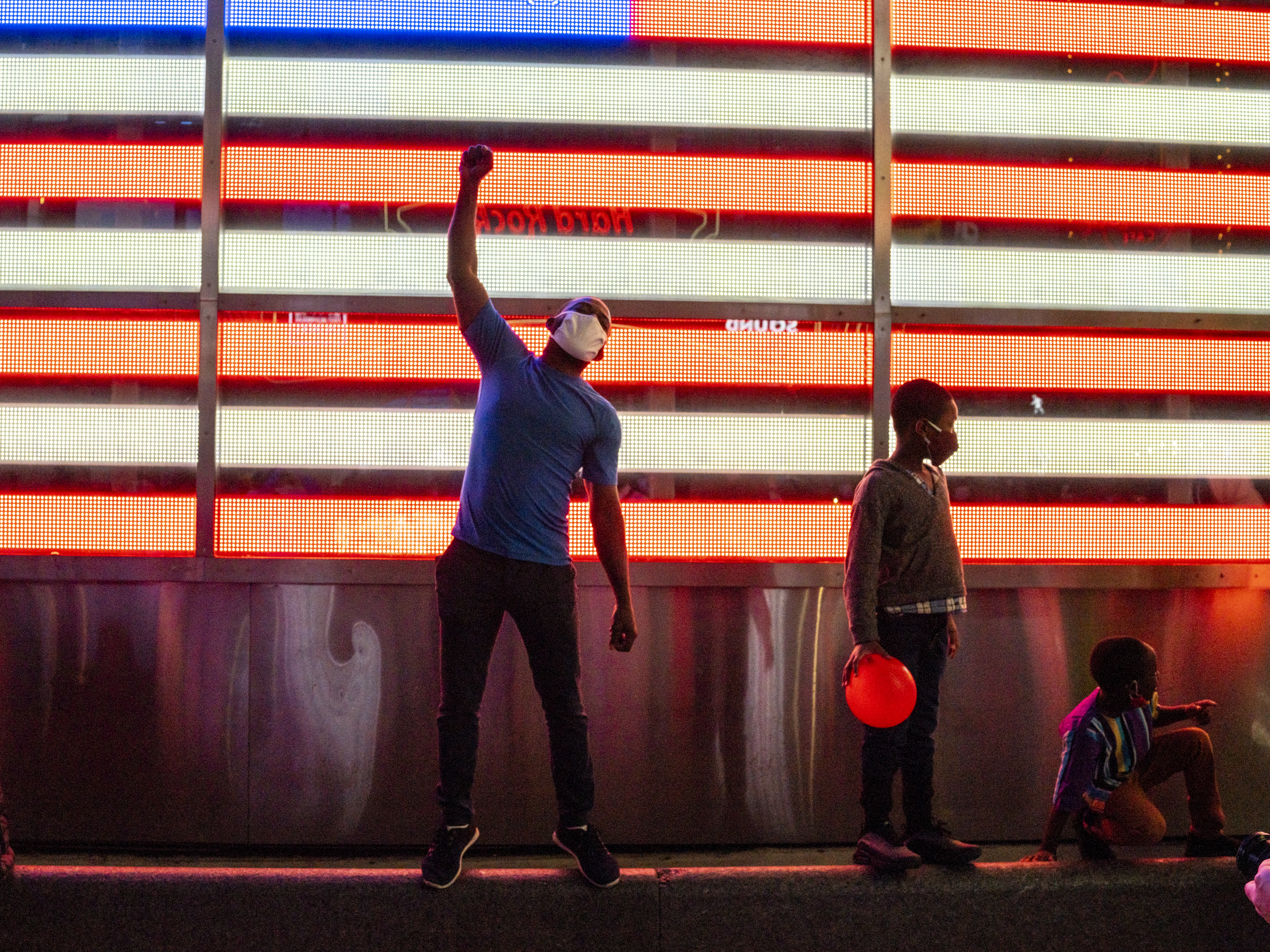 caption: Hundreds of people gathered in Times Square to celebrate Joe Biden defeating Donald Trump to become the 46th President of the United States.