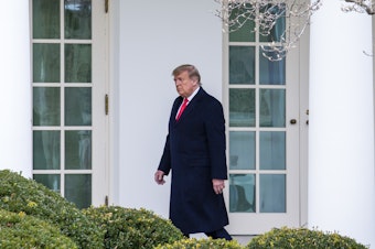 caption: WASHINGTON, DC - DECEMBER 31: U.S. President Donald Trump walks to the Oval Office while arriving back at the White House on December 31, 2020 in Washington, DC.