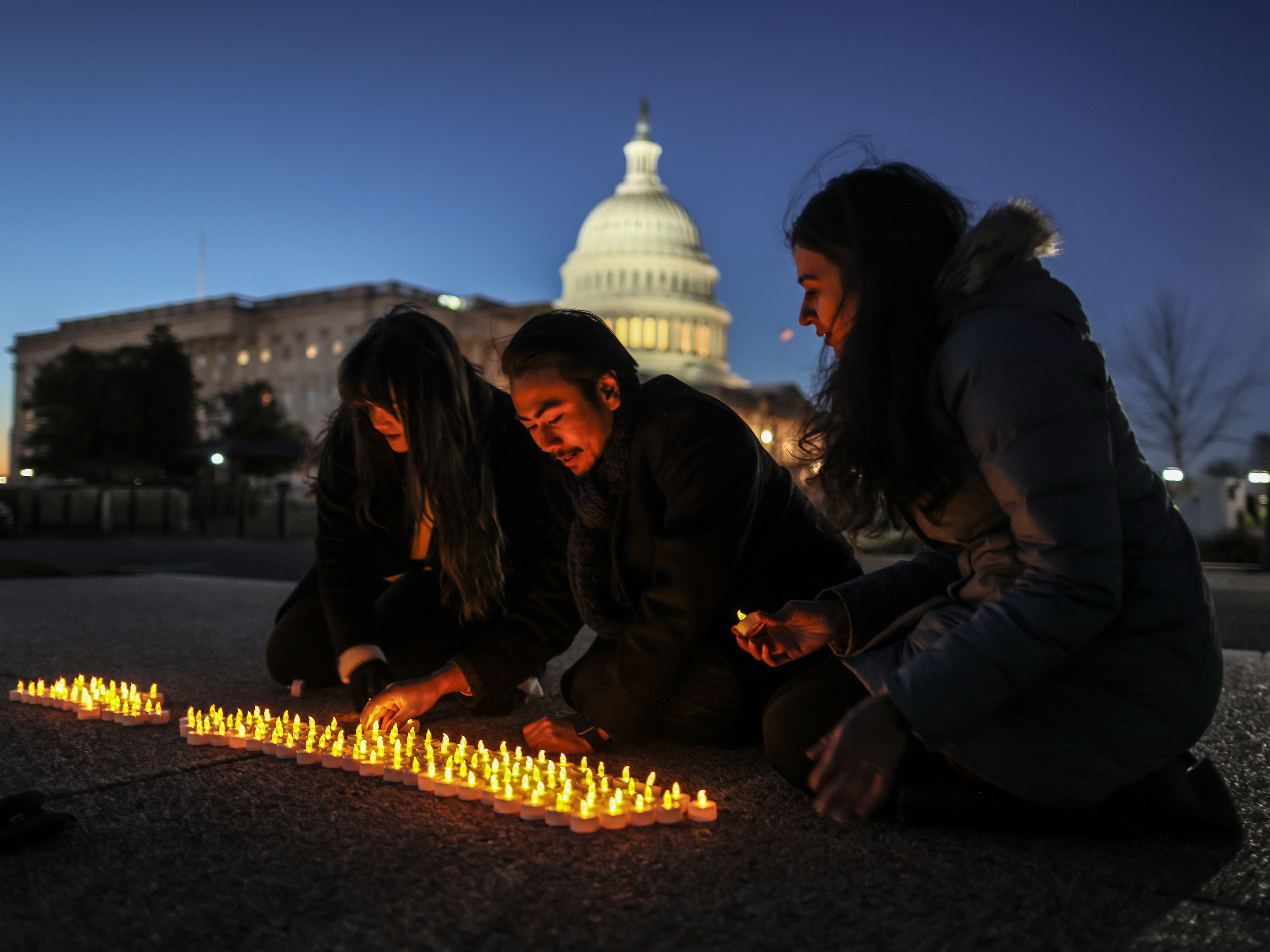 caption: Activists light candles outside the U.S. Capitol on Wednesday to commemorate the 20th anniversary of the U.S. invasion that launched the Iraq War in 2003.