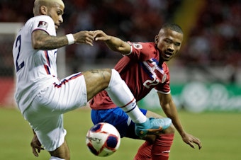 caption: Costa Rica's Ian Lawrence (right) vies for the ball with U.S. player DeAndre Yedlin during their FIFA World Cup Qatar 2022 CONCACAF qualifier match in San Jose, Costa Rica, on Wednesday.
