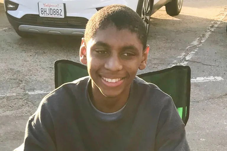 caption: Seven months before his death at CHOP, Antonio Mays Jr. and his father worked together to serve up barbecue at the annual Parade of Lights holiday event in Oxnard, Calif. Antonio Sr. captured photos of his son eating smoked oxtail – a favorite of Antonio Jr.’s, he said – and a strawberry shake from another vendor on Dec. 14, 2019. 