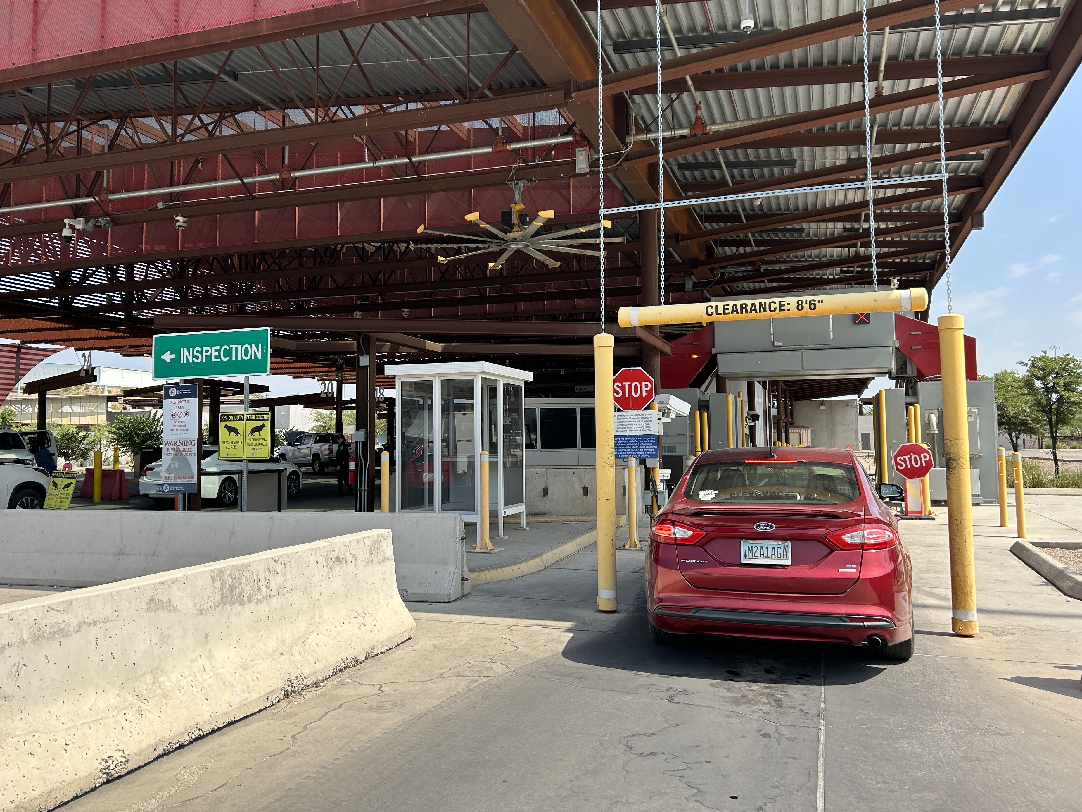 caption: Cars pass through secondary inspection at the Nogales-Mariposa Port of Entry in Arizona.