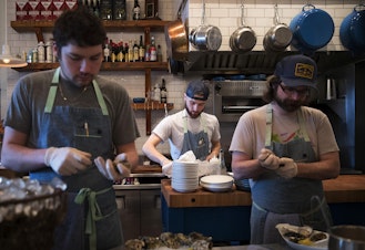caption: From left, Damian Bogas, Evan Potter and Keegan Obrien work on Sunday, March 4, 2018, at the Walrus and the Carpenter in Seattle. 