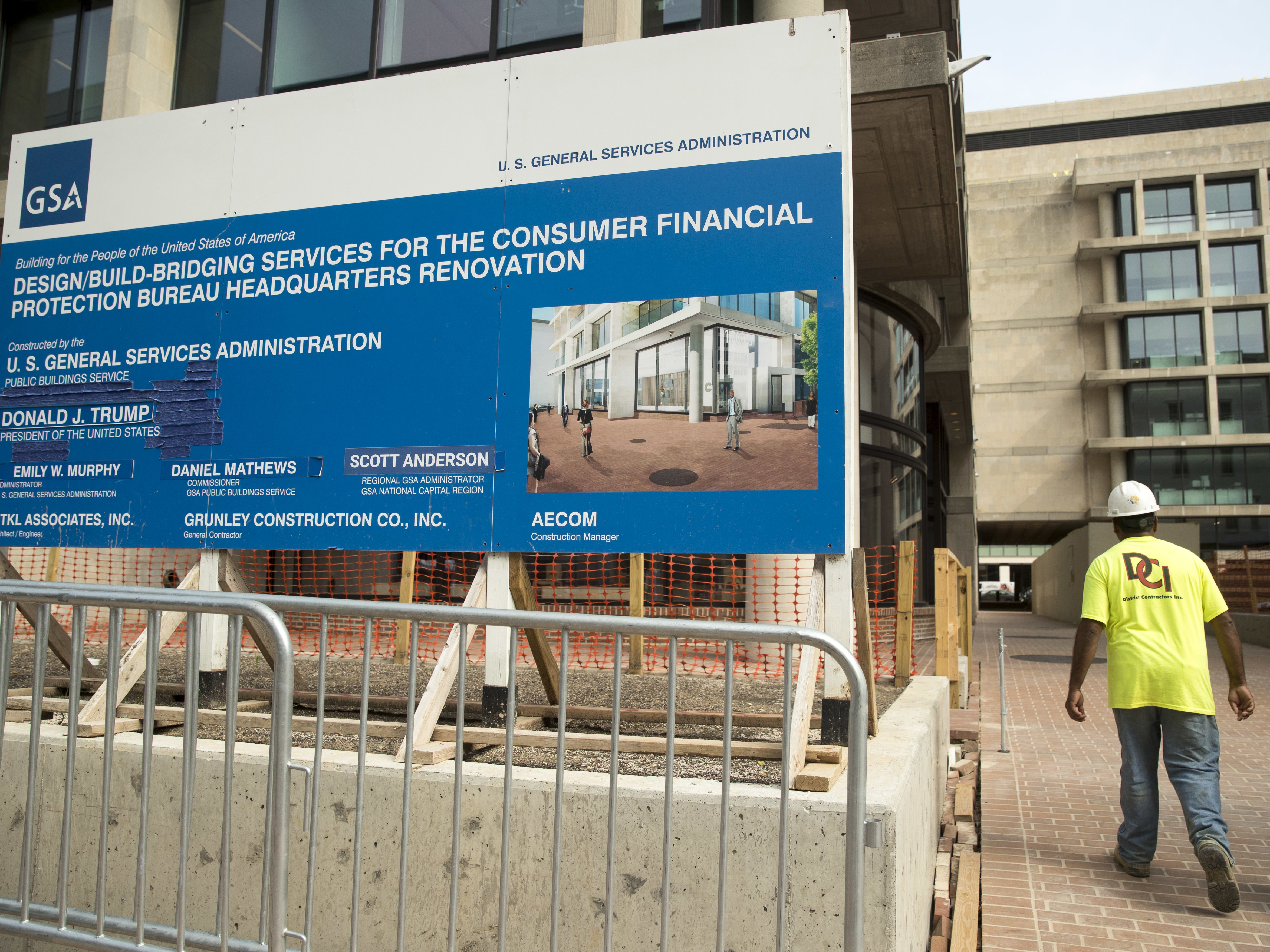 caption: A sign stands at the construction site for the Consumer Financial Protection Bureau's new headquarters in Washington, Monday, Aug. 27, 2018.