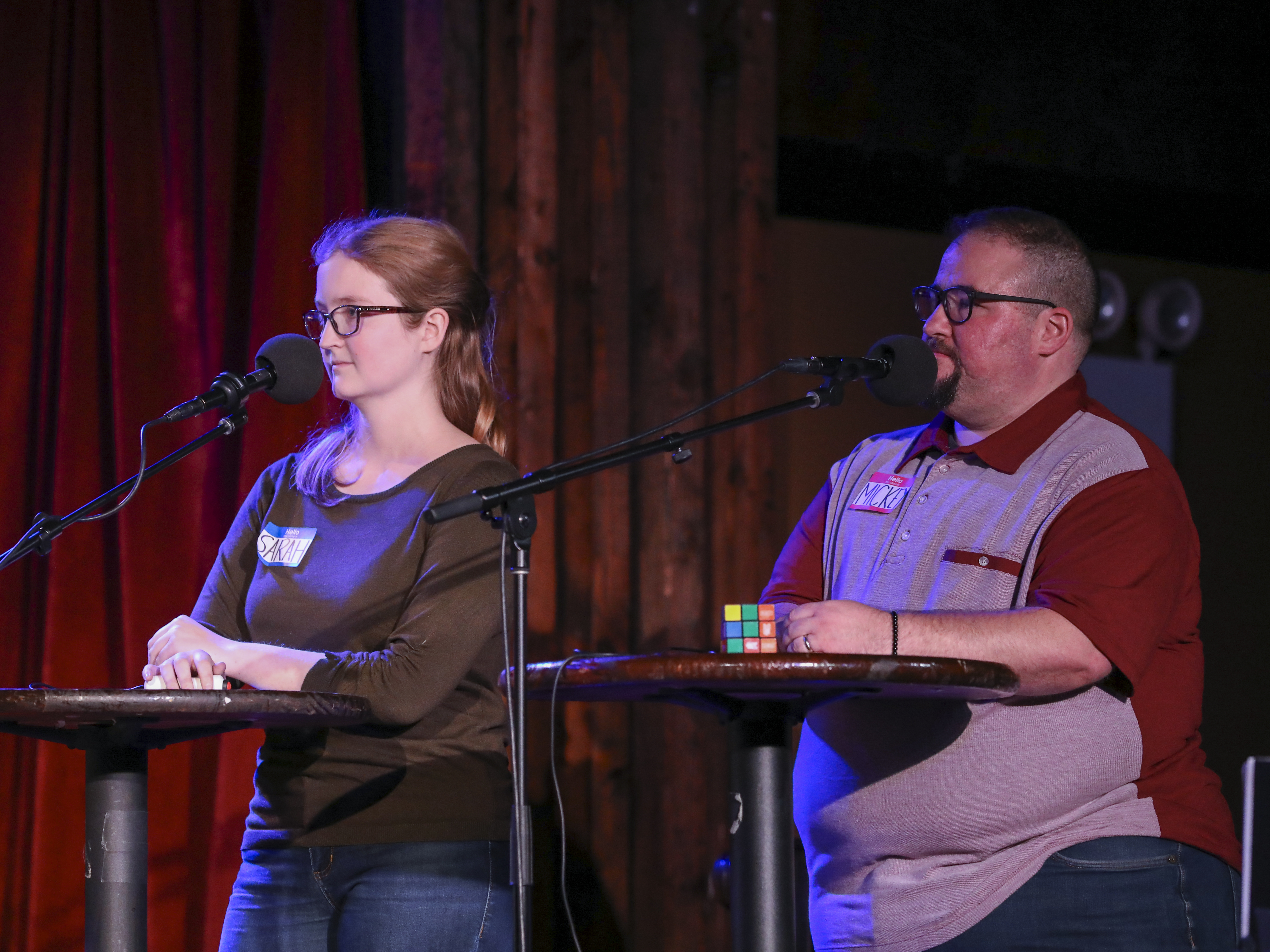 caption: Contestants compete in <em>Ask Me Another</em>'s final round at the Bell House in Brooklyn, New York.