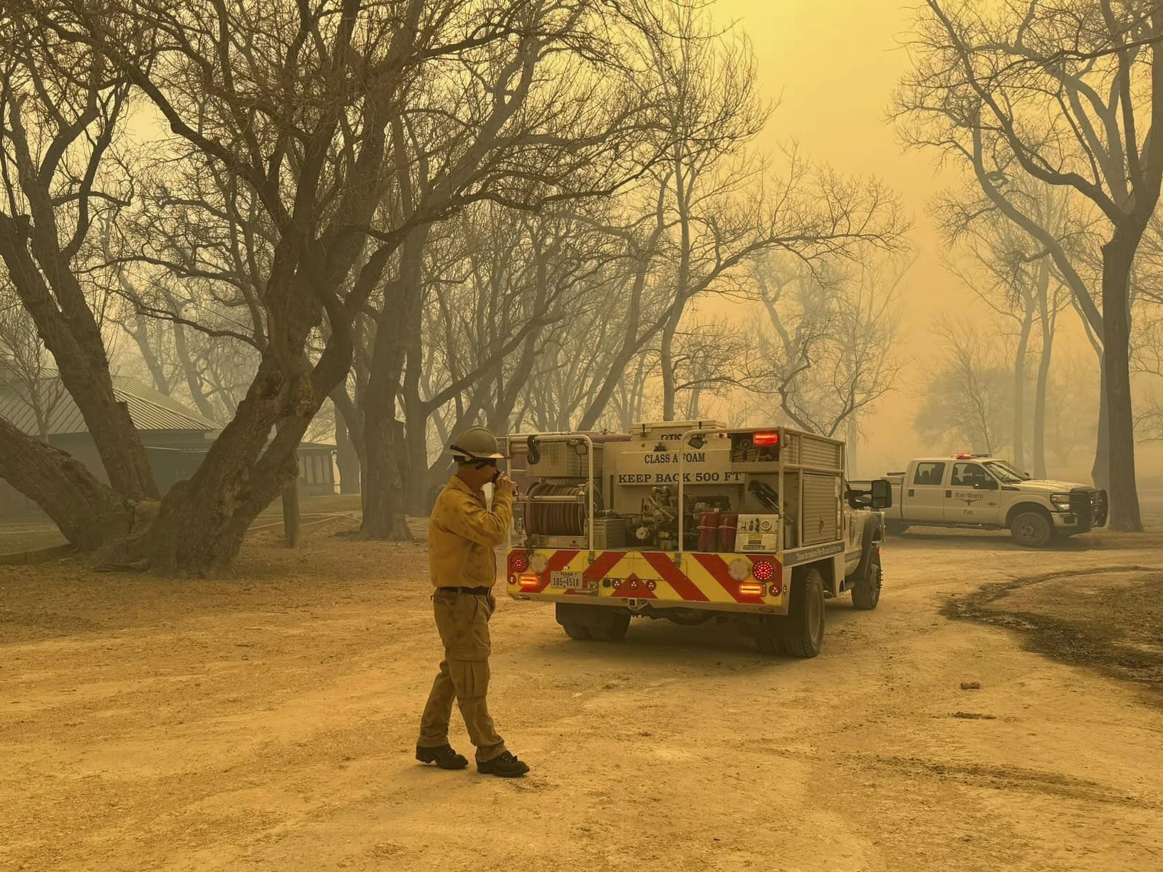 caption: In this photo provided by the Flower Mound, Texas, Fire Department, Flower Mound firefighters respond to a fire in the Texas Panhandle, Tuesday, Feb. 27, 2024.