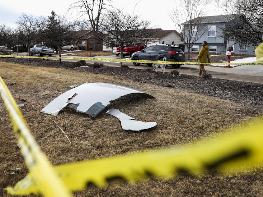 caption: Pieces of the airplane engine from United Airlines Flight 328 sit scattered in a neighborhood after the jet's engine failure on Feb, 20 in Colorado. An engine on the Boeing 777 exploded after takeoff from Denver.
