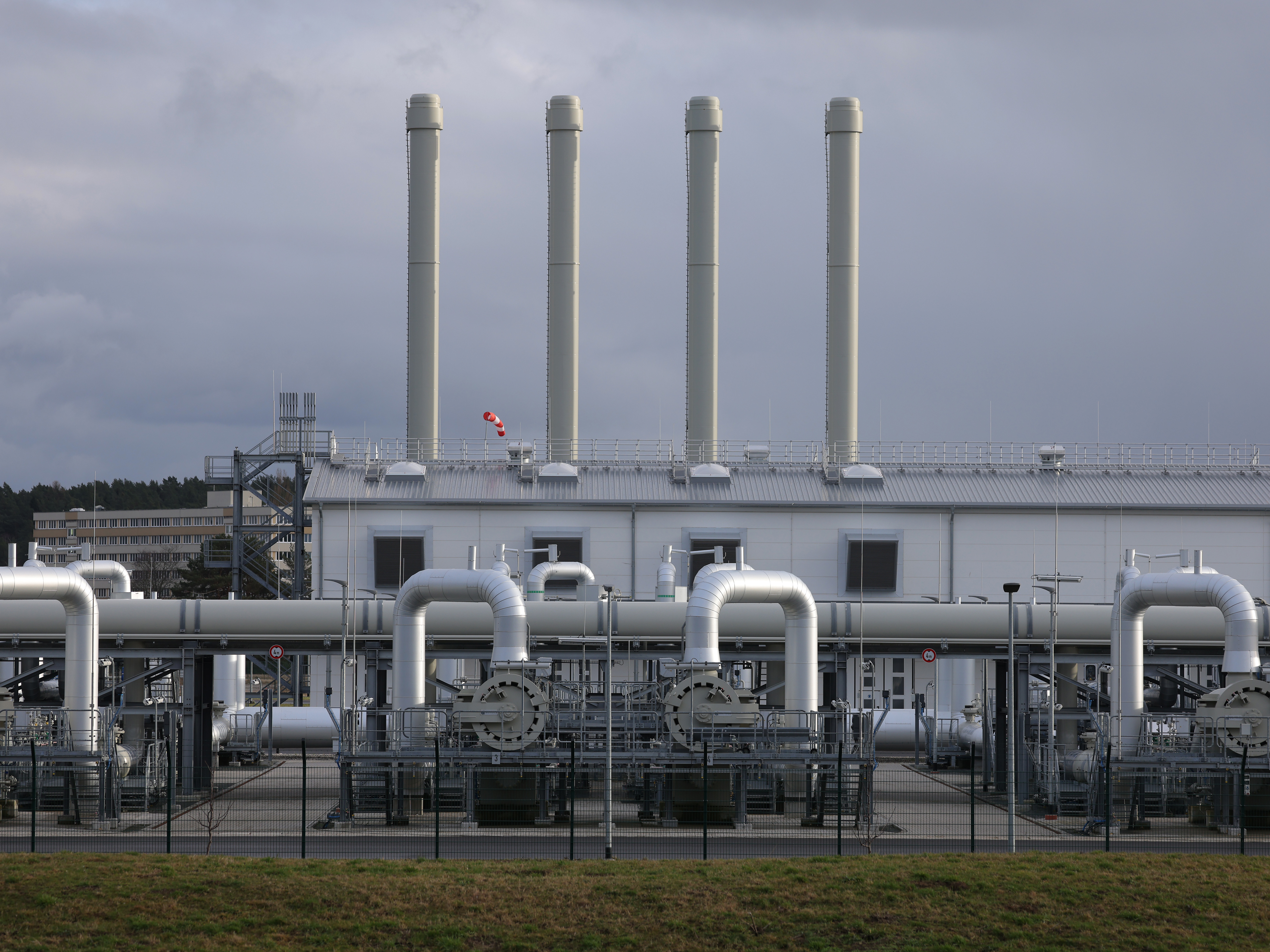 caption: The receiving station of the Nord Stream 2 gas pipeline stands near Lubmin, Germany, on Feb. 2. Nord Stream 2, owned by Russian energy company Gazprom, is to transport Russian natural gas from Russia to Germany, but President Biden has said the pipeline will not go forward if Russia invades Ukraine.