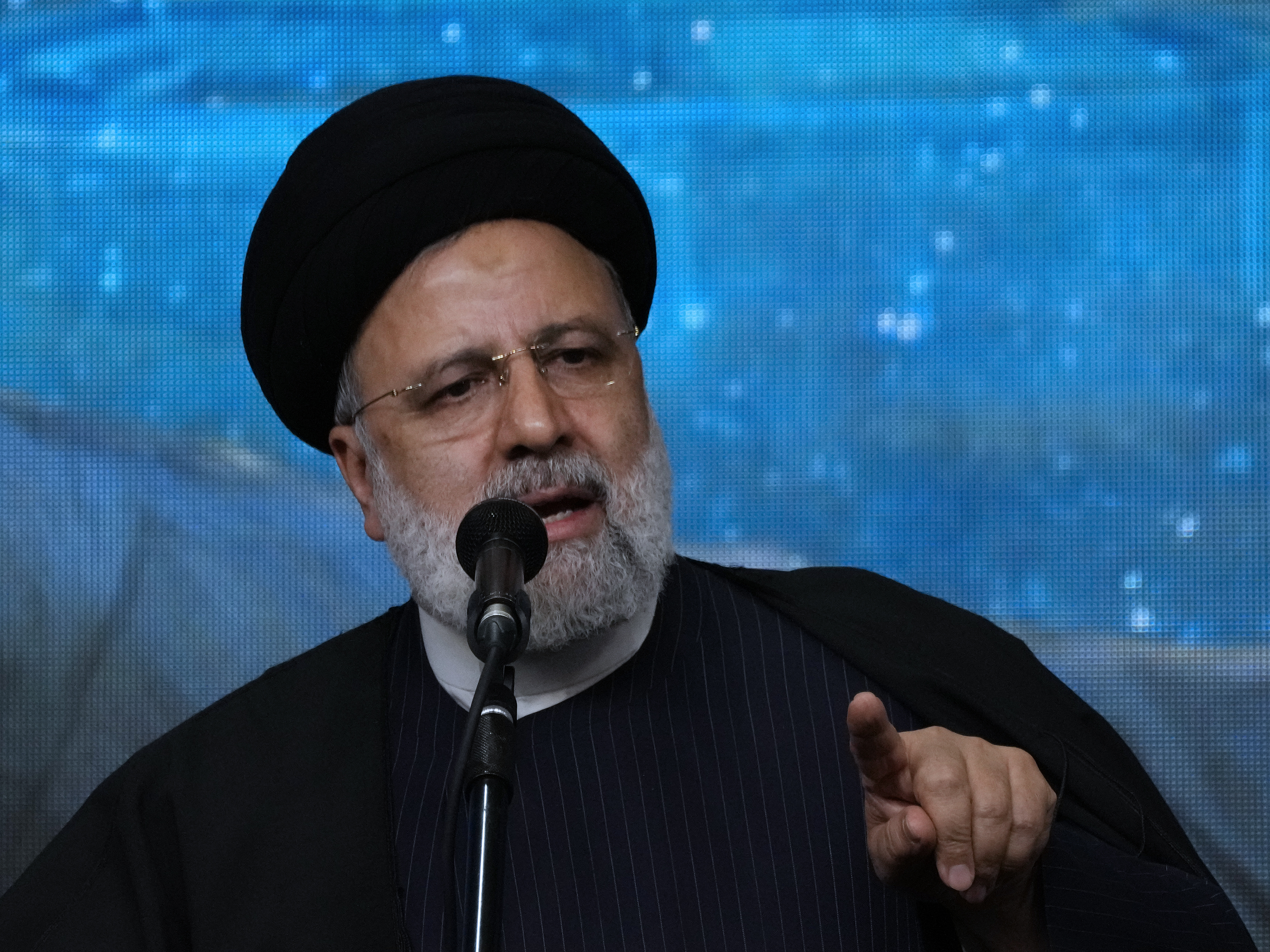 caption: Iranian President Ebrahim Raisi speaks at a mosque in the capital Tehran on Tuesday. Iran manages a network of proxy groups throughout the Middle East that are battling U.S. and Israeli forces on multiple fronts.