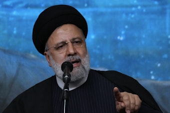 caption: Iranian President Ebrahim Raisi speaks at a mosque in the capital Tehran on Tuesday. Iran manages a network of proxy groups throughout the Middle East that are battling U.S. and Israeli forces on multiple fronts.