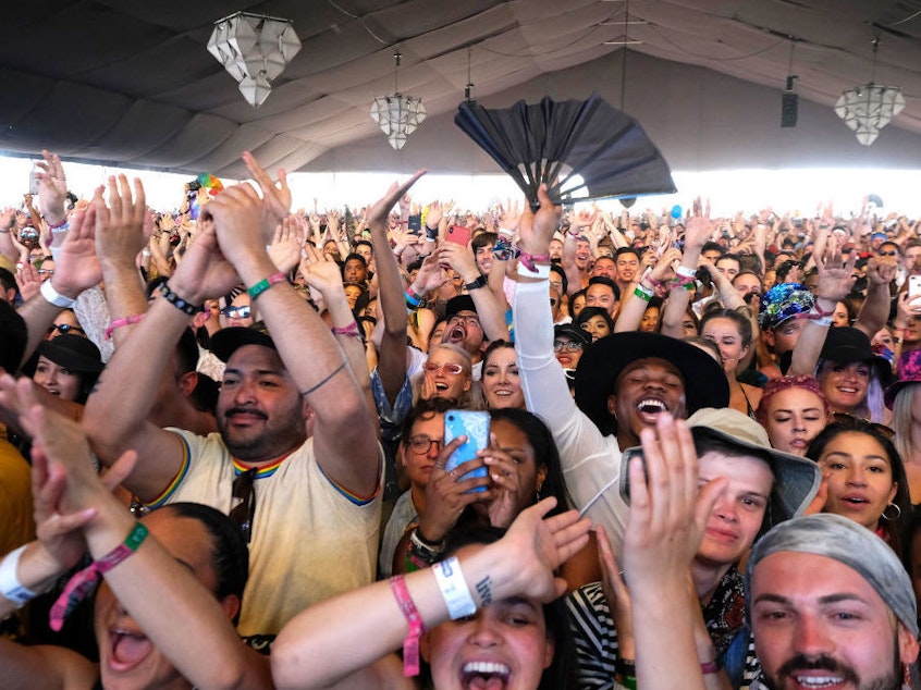 caption: Fans watch singer Lizzo perform during the 2019 Coachella Festival last April.