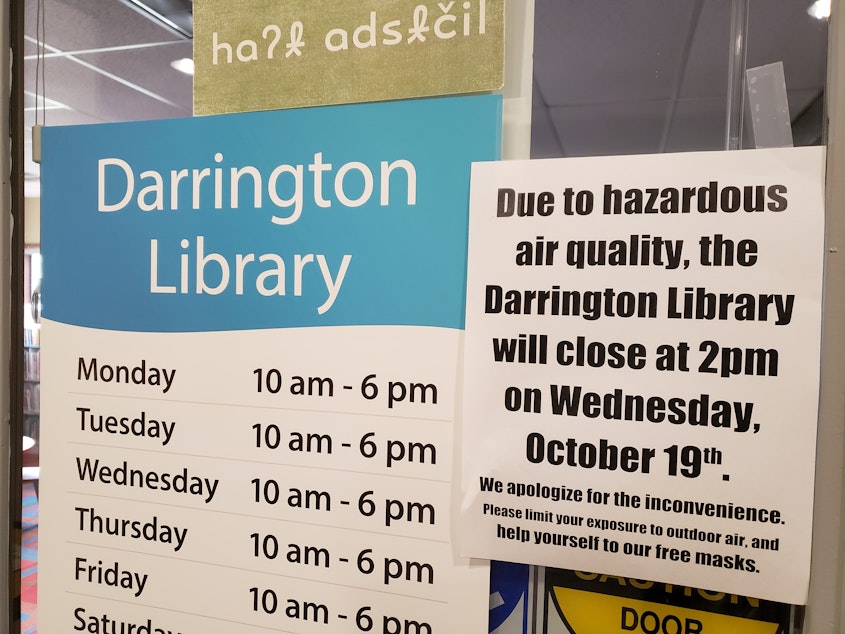 caption: The Darrington Library closed early on Wednesday due to hazardous air conditions. The library had a basket of masks for people to take. Wednesday, October 19, 2022.