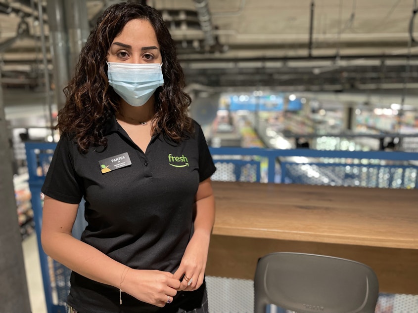 caption: Pantea Naghibi is the store manager at Amazon Fresh's 23rd and Jackson store