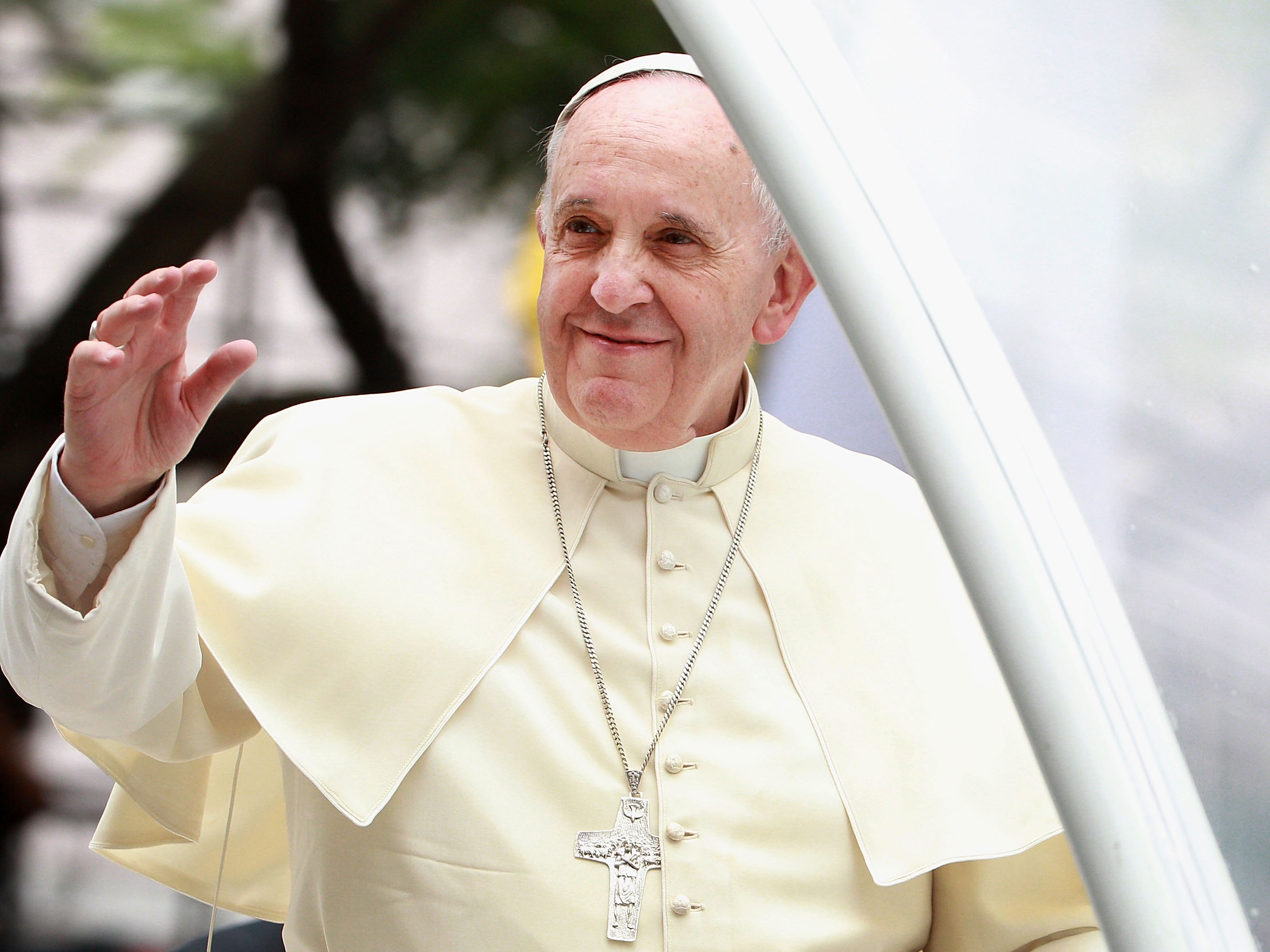 caption: Pope Francis waves to thousands of followers as he arrives at the Philippines' Manila Cathedral on Jan. 16, 2015. During his papacy, Francis strove to reach out to what he called the "periphery" of the world in Asia, Africa and Latin America.