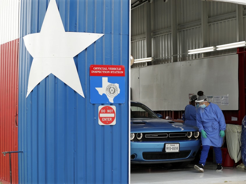 caption: Patients can get COVID-19 diagnostic and antibody tests at a converted vehicle inspection station in San Antonio, as the state reports a record number of hospitalizations and single-day case increases.