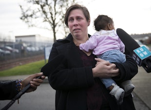 caption: Rebecca Fatty becomes emotional while holding her 4-month-old daughter Sunkarah as she speaks to the press after her husband Bangally Fatty was denied bond on Wednesday, November 29, 2017, at the Northwest Detention Center in Tacoma. 