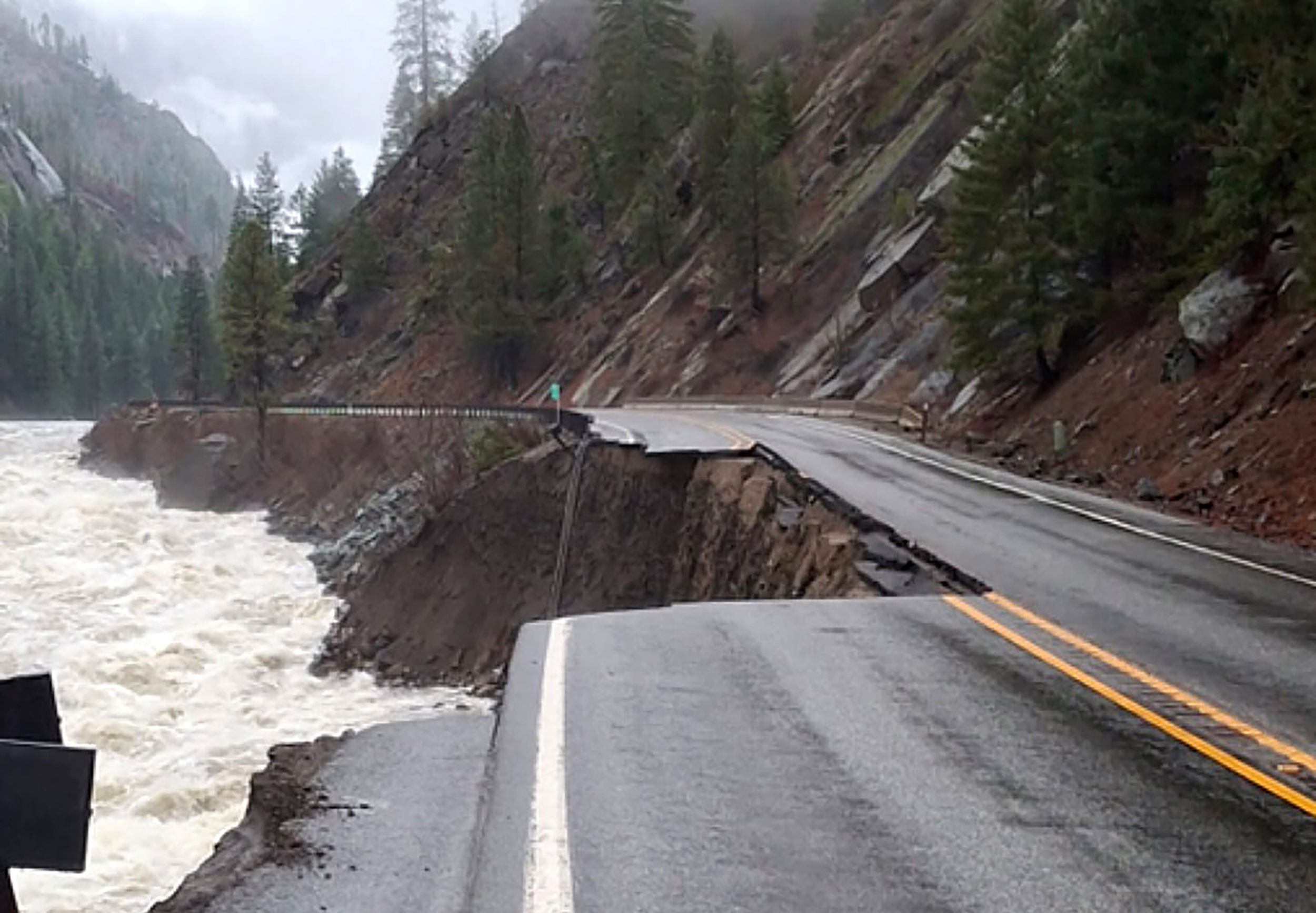 caption: Road damage along U.S. 2 in Tumwater Canyon is shown on Dec. 16, 2025. 