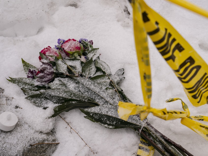 caption: Flowers are seen outside the off-campus home where the quadruple murder took place in Moscow, Idaho.