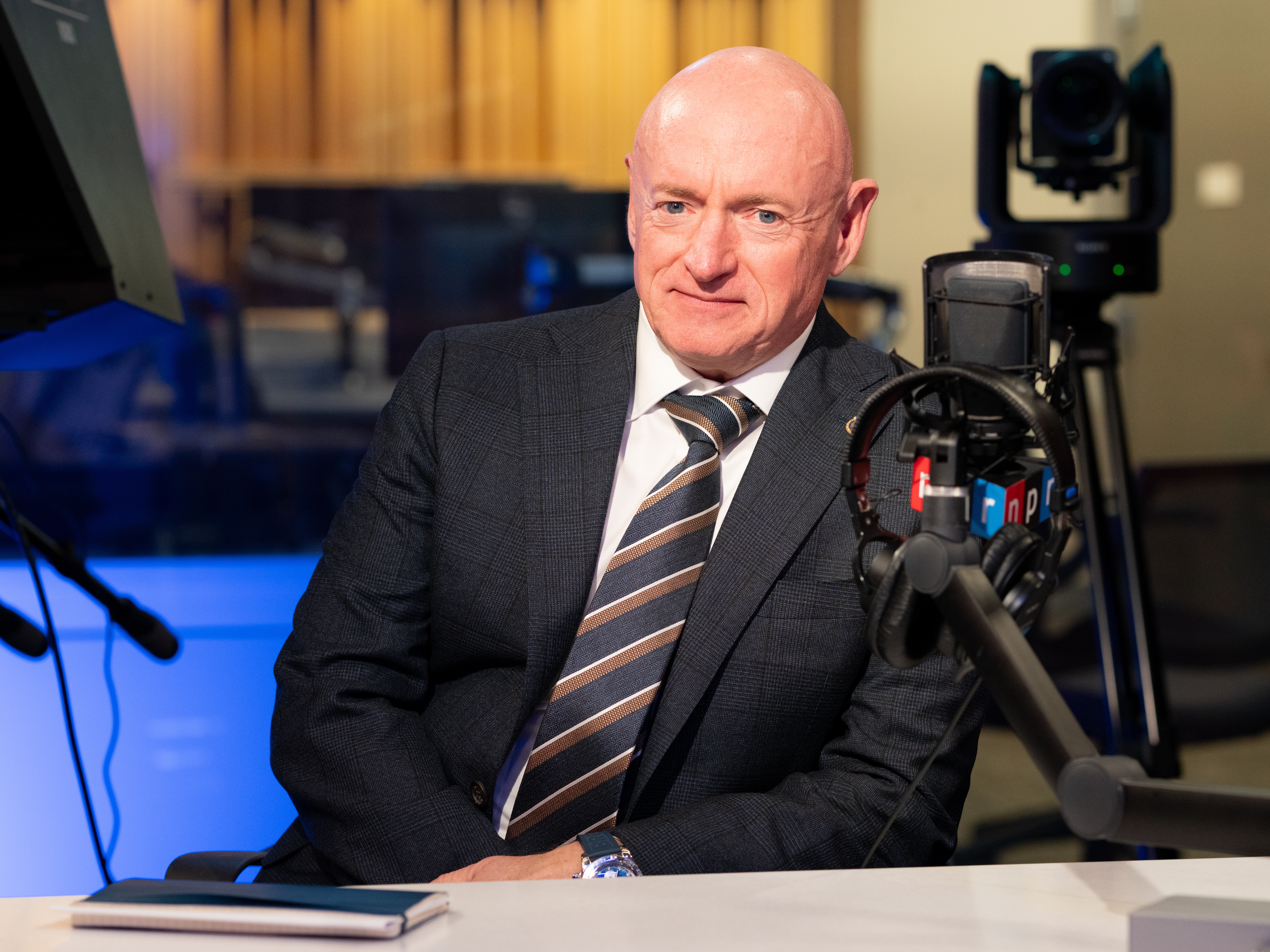 caption: Arizona Sen. Mark Kelly during a visit to NPR headquarters on Nov. 18, 2025.