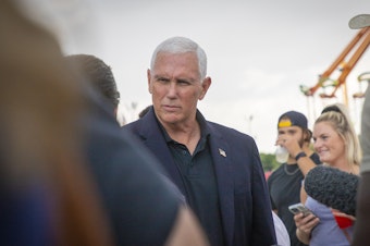 caption: Former Vice President Mike Pence campaigns for Sen. Chuck Grassley at the Iowa State Fair in Des Moines, Iowa on August 19, 2022.