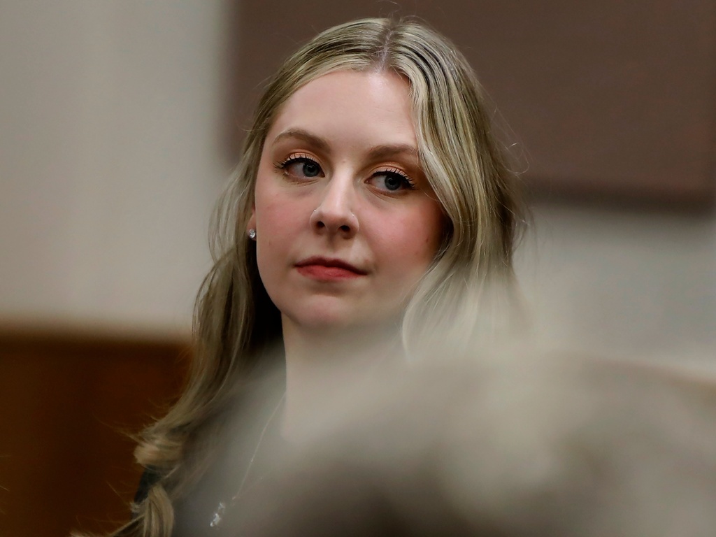 caption: Former Richneck Elementary School teacher Abby Zwerner looks back into the courtroom Oct. 28 during her civil lawsuit trial in Newport News, Va.