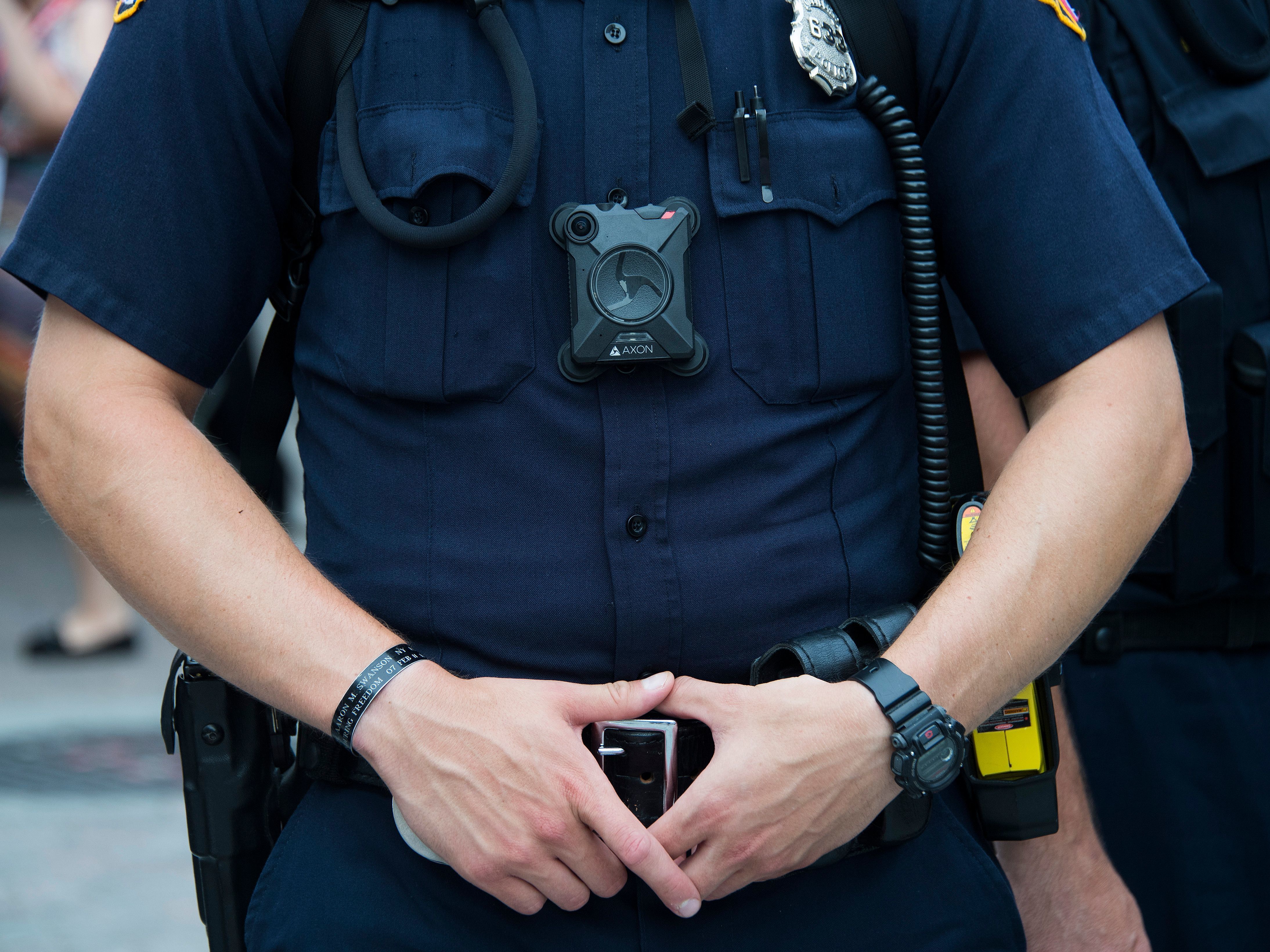 caption: Federal agents will soon be required to wear body cameras in certain situations, Deputy Attorney General Lisa Monaco announced on Monday.