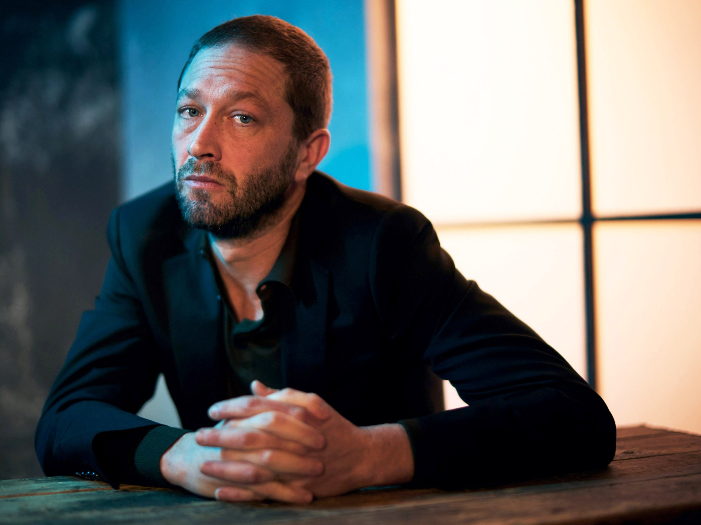 caption: Ebon Moss-Bachrach returns as Richie in Season 4 of<em> The Bear.</em>