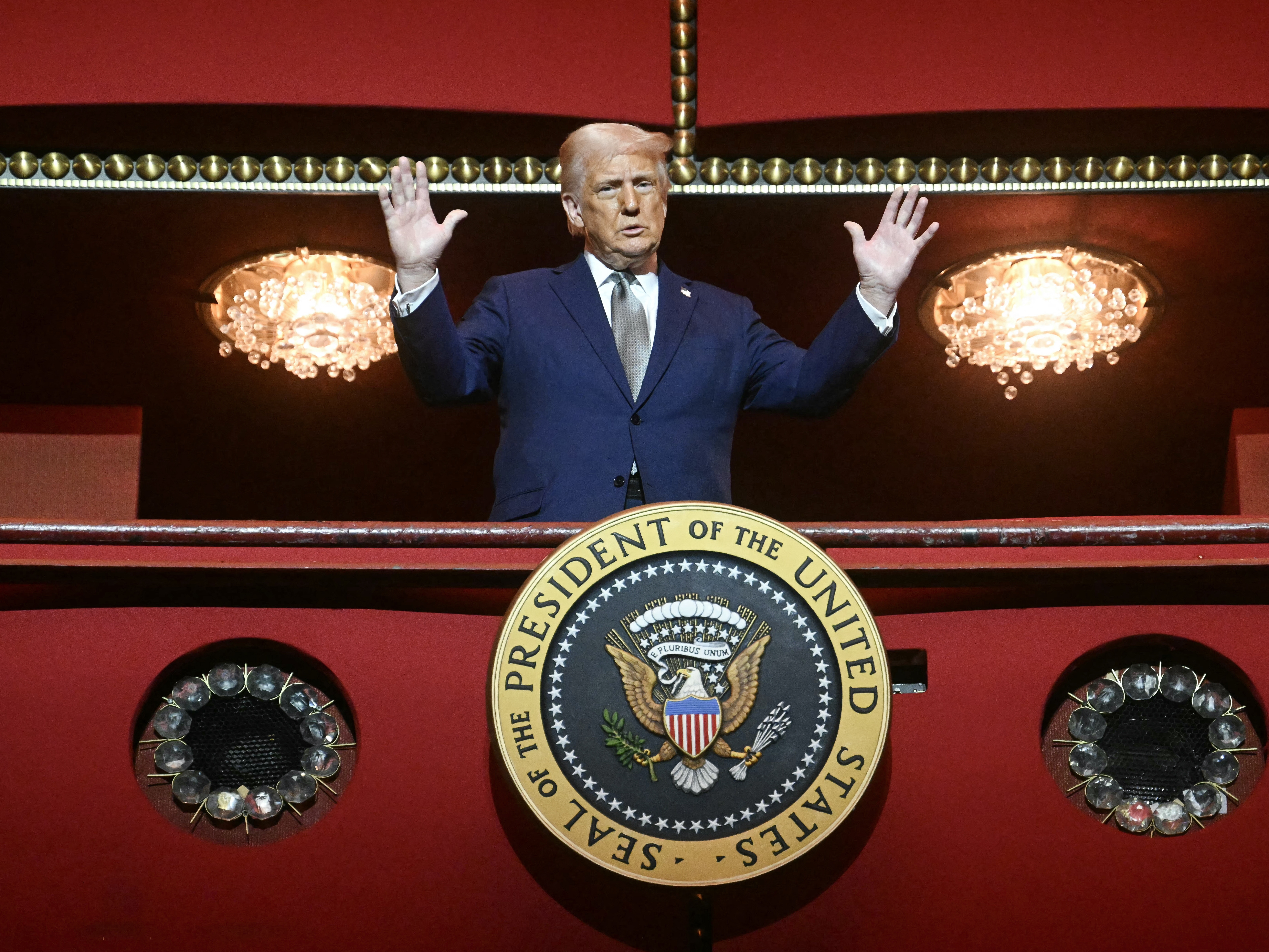caption: President Trump stands in the presidential box as he tours the John F. Kennedy Center for the Performing Arts in Washington, D.C., on March 17.