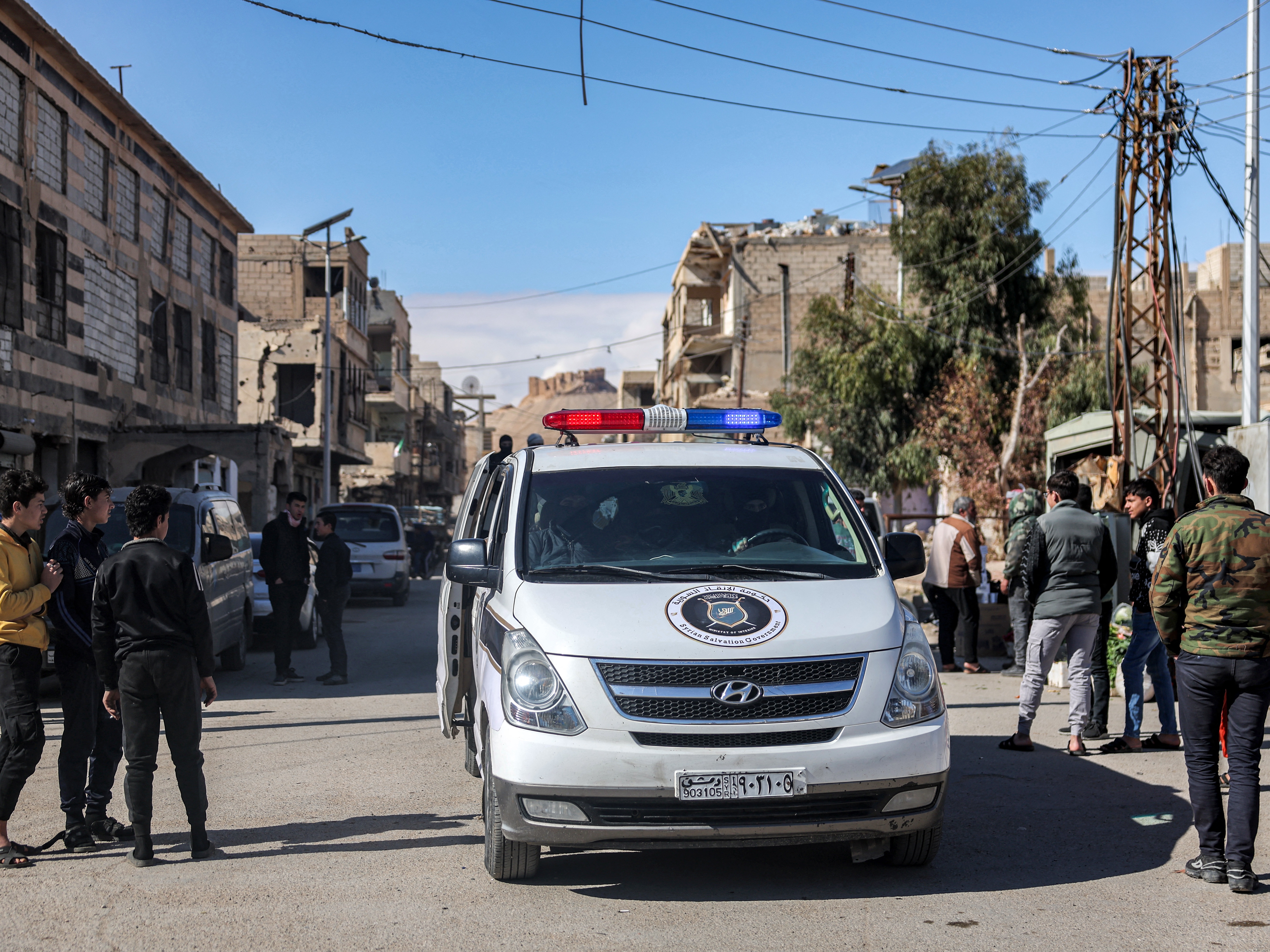 caption: A police vehicle of the interim Syrian government moves through a street in Palmyra in central Syria on Feb. 7. On Saturday, two U.S. service members and one U.S. civilian were killed in Palmyra after an ambush by an ISIS gunman, U.S. officials said.