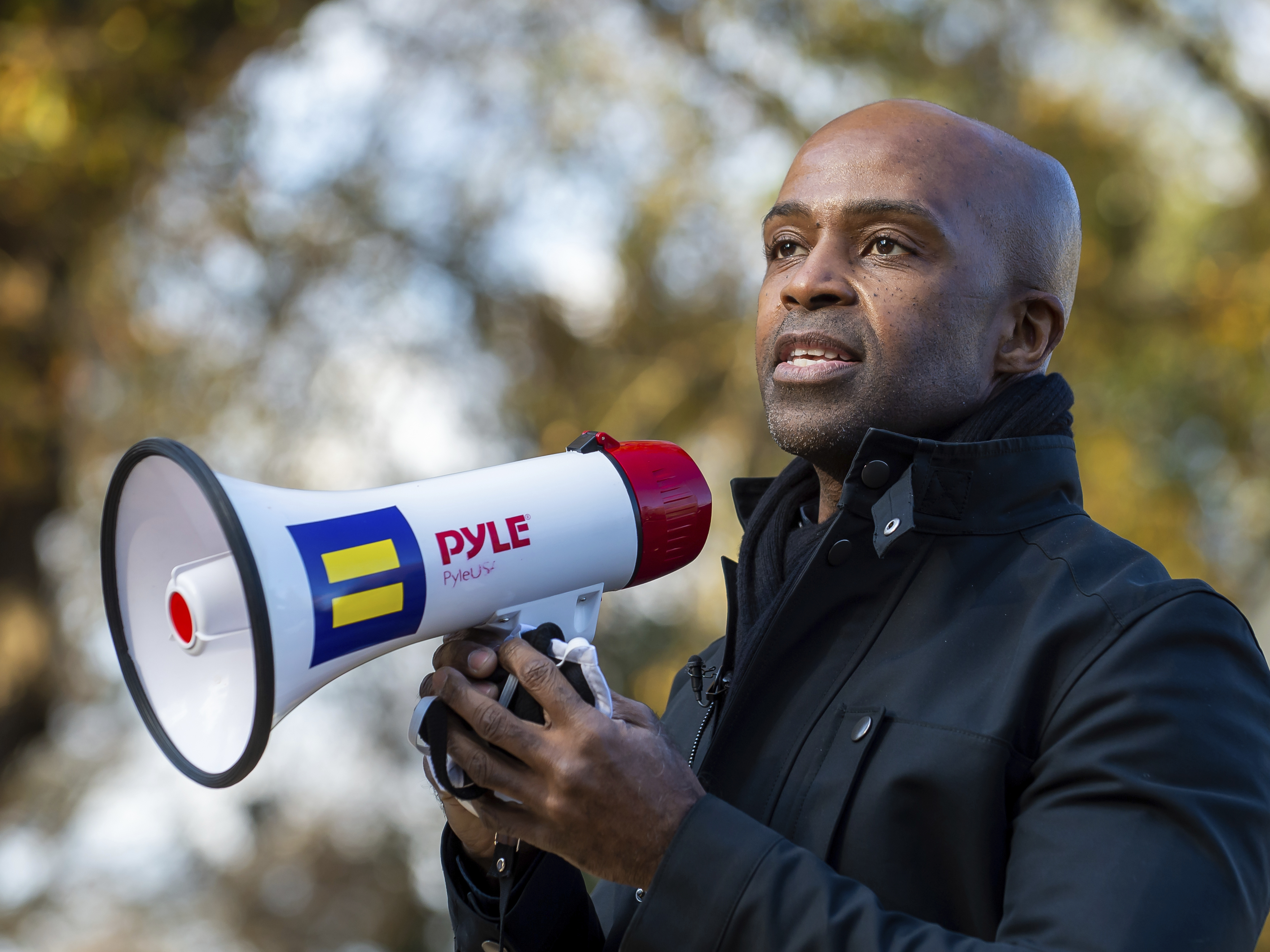 caption: Human Rights Campaign president Alphonso David speaks to supporters on Saturday Dec.19, 2020 during a get-out-the-vote event at a private residence in Dunwoody, Ga. David has filed a lawsuit against the organization in federal court, alleging that he was underpaid and then terminated because he is Black.