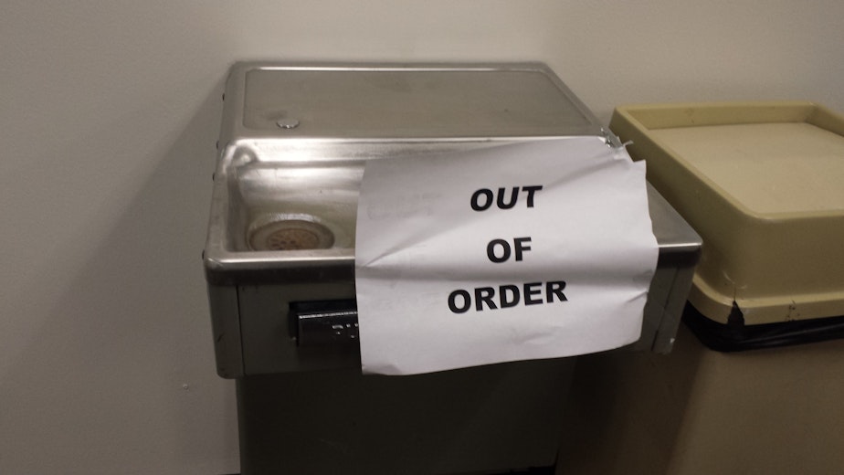 caption: An out of order water fountain at the King County Juvenile Detention Center. Water pipes are old and rusting, and a new building is being planned despite anti-incarceration protests. 