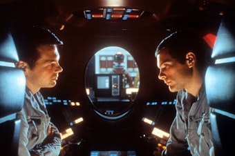 caption: Malevolent robot stories used to be more about brawn than brain — so it was a genuine shock for audiences in 1968 when the sentient HAL-9000 computer calmly said, "I'm sorry, Dave, I'm afraid I can't do that." Above, Gary Lockwood and Keir Dullea in <em>2001: A Space Odyssey</em>.