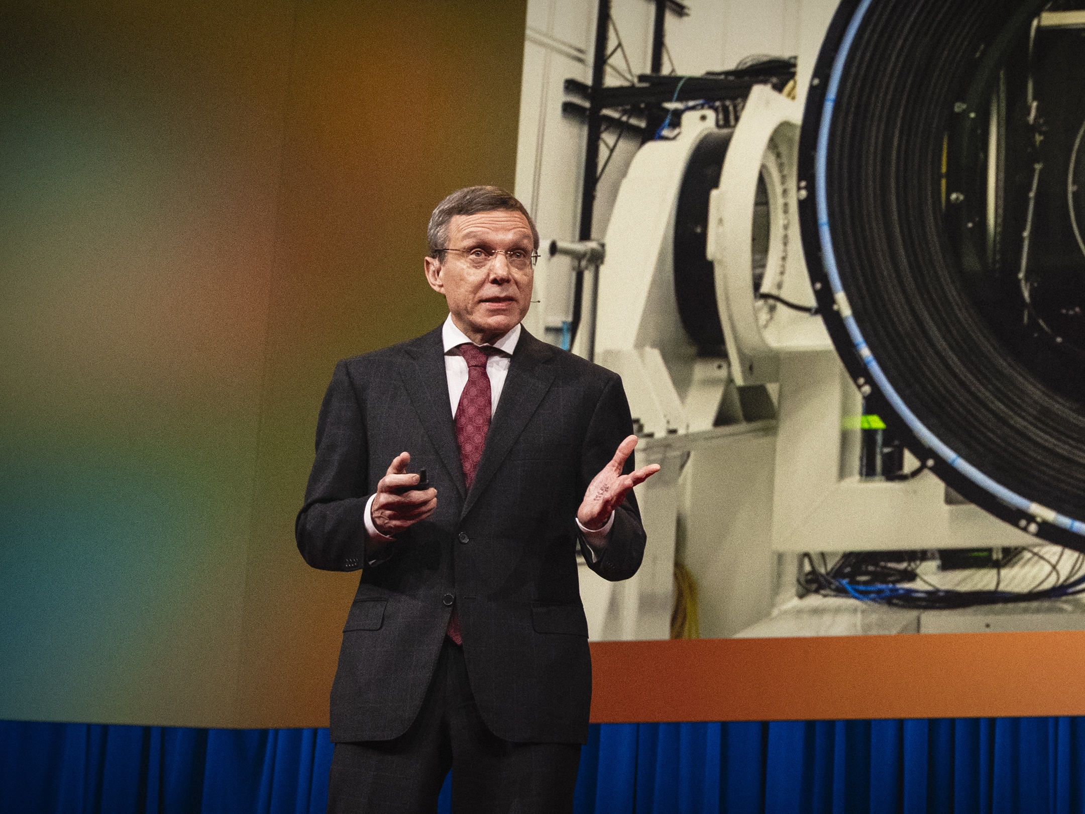 caption: Avi Loeb speaks at TED2024