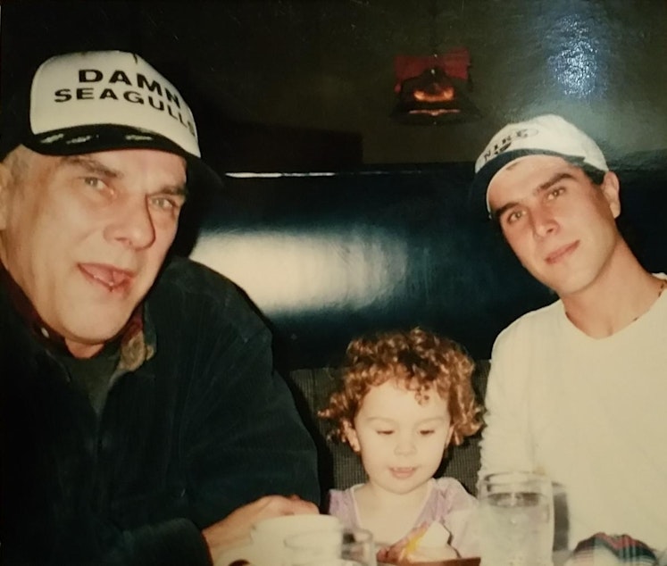 caption: Shawn Kamp, right, with his father James and niece in 1998.
