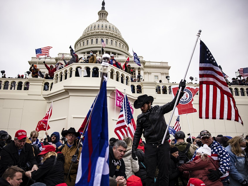 caption: Trump supporters storm the U.S. Capitol following the then-president's rally on Jan. 6, 2021.