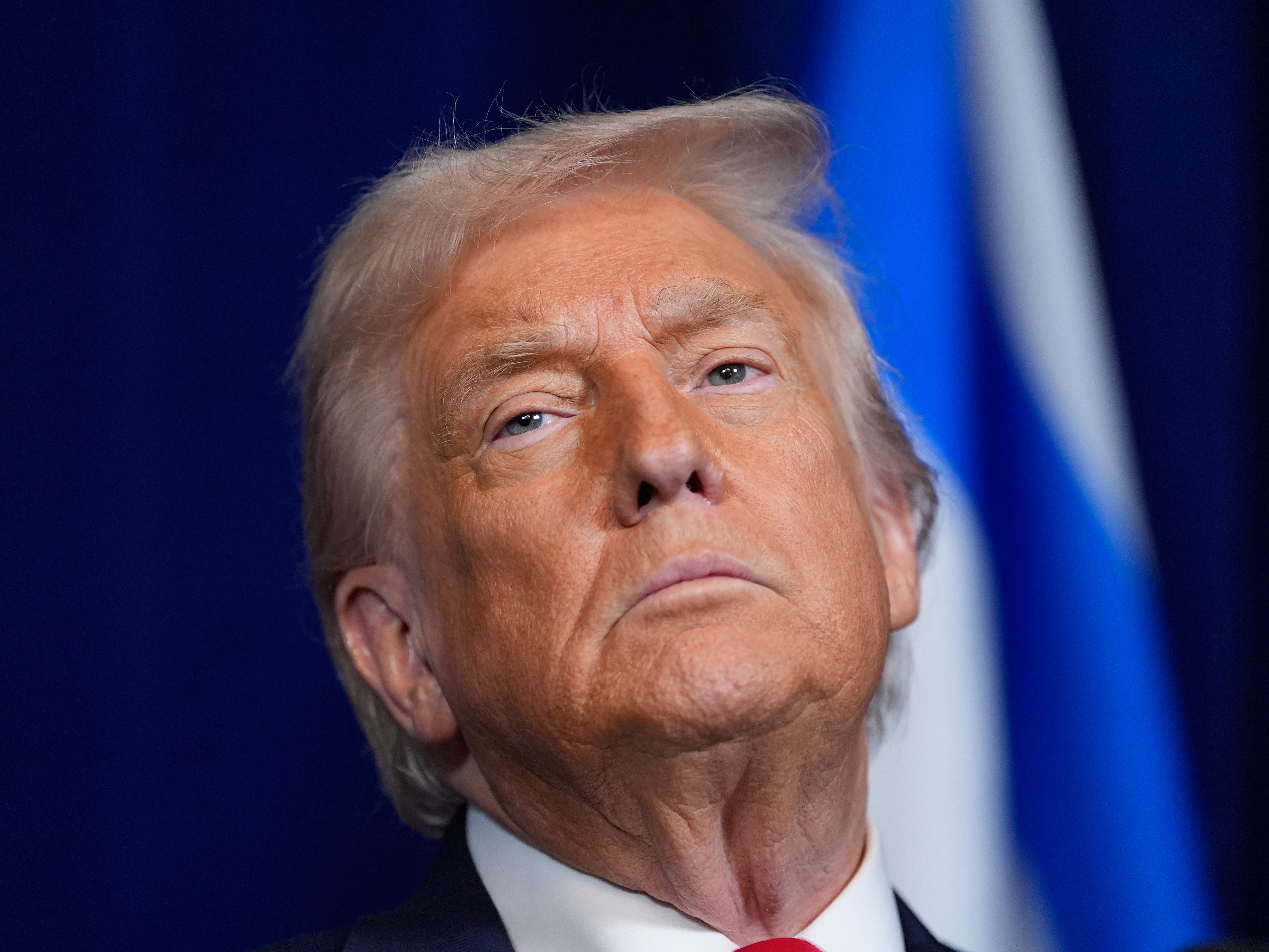 caption: President Donald Trump listens during a news conference with Israel's Prime Minister Benjamin Netanyahu at Mar-a-Lago, Monday, Dec. 29, 2025, in Palm Beach, Fla. (AP Photo/Alex Brandon)