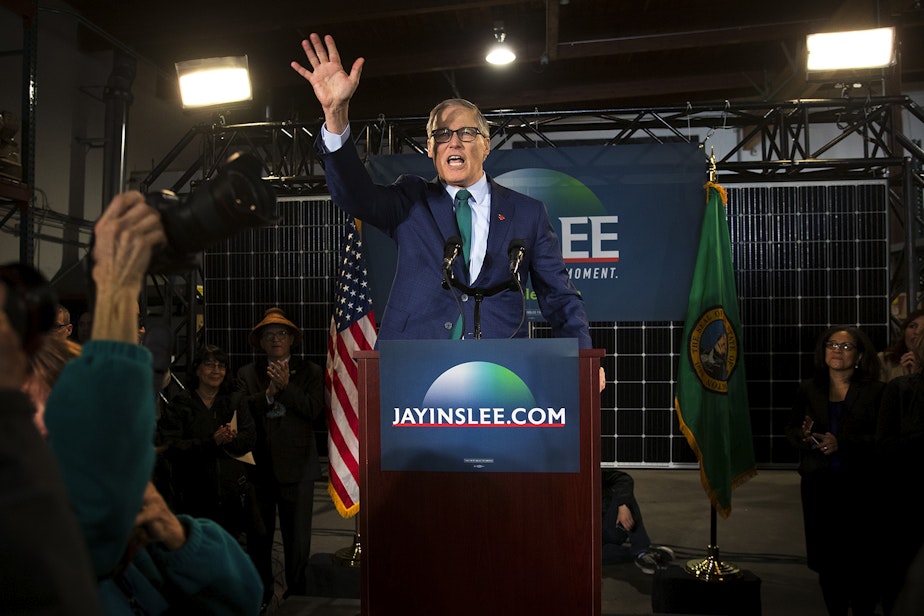 caption: Governor Jay Inslee waves to a crowd after formally launching a campaign for presidency on Friday, March 1, 2019, at A&R Solar on Martin Luther King Jr. Way in Seattle.